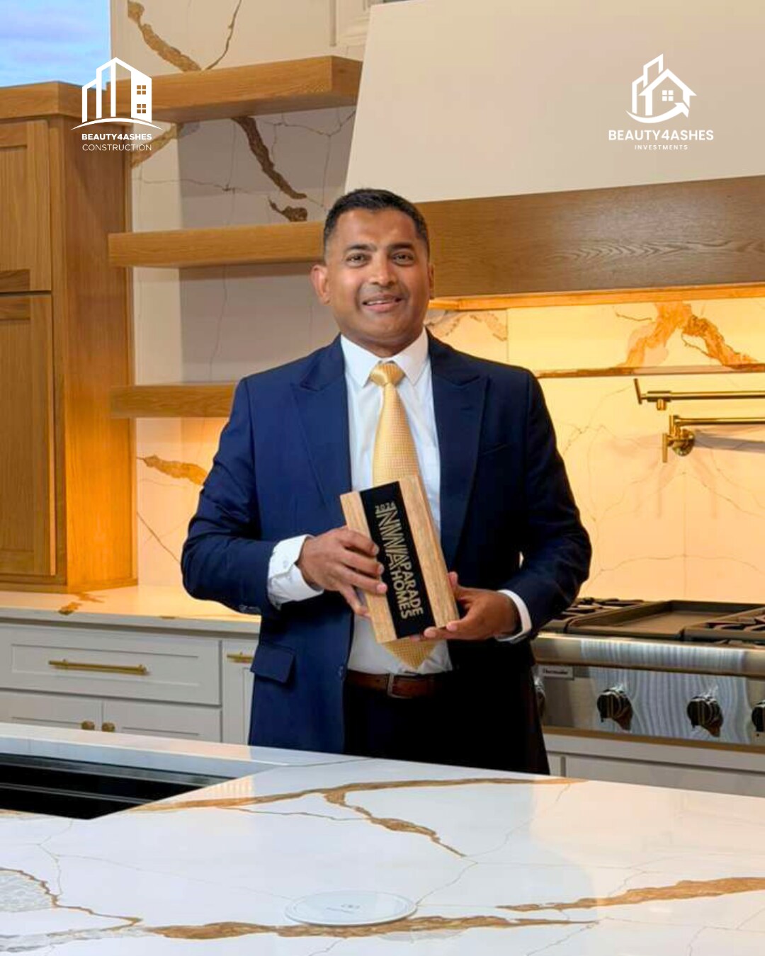 Beauty4Ashes founder holding the 2026 NWA Parade of Homes trophy in the award-winning kitchen
